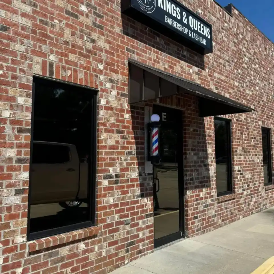 Brick storefront with commercial window film installed by South Side Detail And Tint in Houma, LA