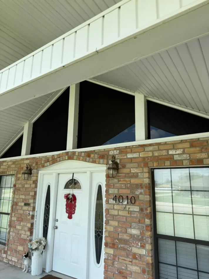 Brick home entry with residential window film that blocks heat and UV in Houma, LA