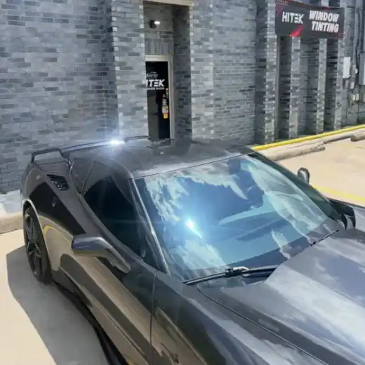 Black sports car with window tint at the South Side Detail And Tint shop in Houma, LA