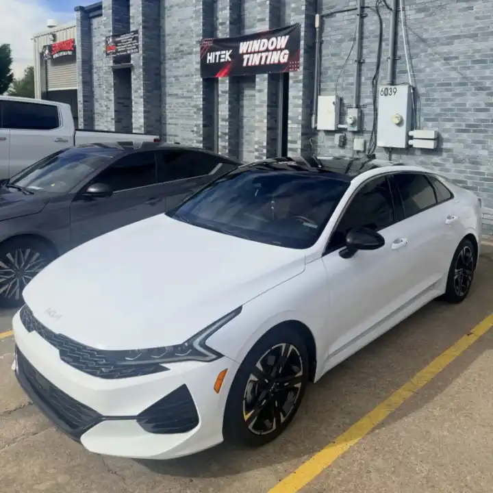 White Kia sedan with car window tinting at South Side Detail And Tint for Bayou Cane drivers