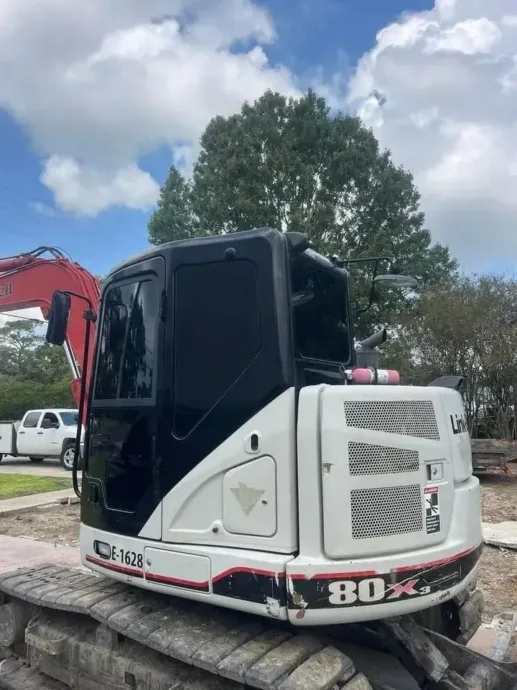 Excavator cab with window tint installed in Houma, LA