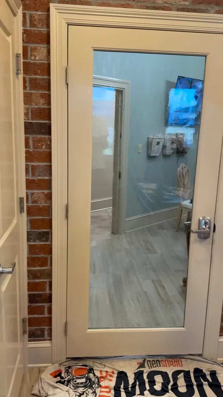 Privacy window film on an office glass door, commercial window tinting in Houma, LA