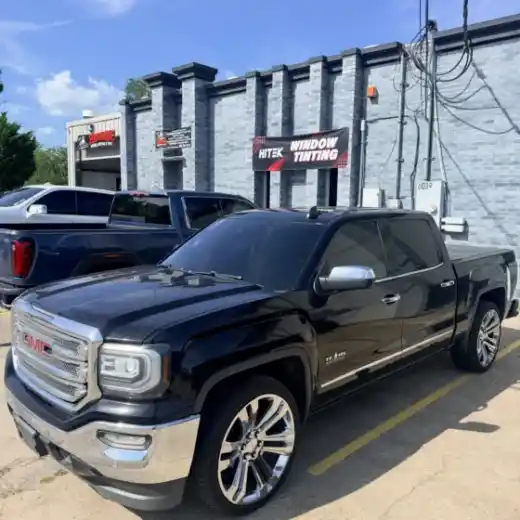 Black GMC Sierra pickup with tinted windows at South Side Detail And Tint in Houma, LA